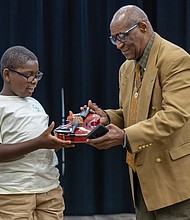 Jer’Miah Bing and two fellow Music Orchard Richmond and Peter Paul RVA musicians received free violins from 725 Arts and Culture’s Trumpeting for the Arts at the concert.