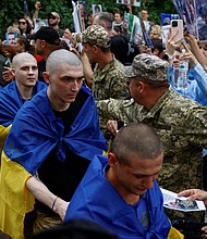 Ukrainian prisoners of war leave a bus as they return after a swap, amid Russia's attack on Ukraine, in an undisclosed location in Ukraine, June 9, 2025.
Mandatory Credit:	Valentyn Ogirenko/Reuters via CNN Newsource