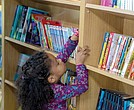 A student browses available books inside the Henrico County Public Schools’ Mobile Resource Center.