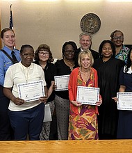 Newly sworn-in Court Appointed Special Advocates (CASA), from left, Katrina Yates, Charles Jackson, Lauren Schwartz, Chrishell Thomas, Shawn Gannon, Sabrina Brown, Jim Kohler, Patricia Chipko, Lafonda McWilliams-Wyatt, Alysse Stephens, Courtney Lawerence and E’Lexus Hatten, are joined by Henrico County Juvenile and Domestic Relations District Court Judge Stacy E. Lee.