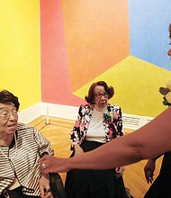 Jill Bussey Harris, right, of the Richmond Chapter of The Links, Incorporated, greets Lucille M. Brown, left, and honorary chair Barbara Grey at the Virginia Museum of Fine Arts March 25, 2017.