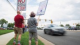 Protesters gather at the intersection of West Broad Street and Dominion Boulevard in Innsbrook on June 7 to denounce U.S. Rep. Rob Wittman’s support of President Trump’s “One Big, Beautiful Bill.” The demonstration was organized by Henrico Democrats and other groups.