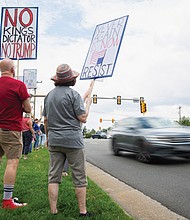 Protesters gather at the intersection of West Broad Street and Dominion Boulevard in Innsbrook on June 7 to denounce U.S. Rep. Rob Wittman’s support of President Trump’s “One Big, Beautiful Bill.” The demonstration was organized by Henrico Democrats and other groups.