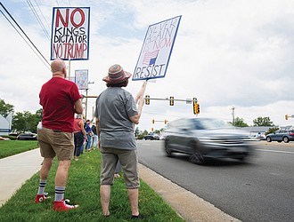 Protesters gather at the intersection of West Broad Street and Dominion Boulevard in Innsbrook on June 7 to denounce U.S. Rep. Rob Wittman’s support of President Trump’s “One Big, Beautiful Bill.” The demonstration was organized by Henrico Democrats and other groups.