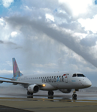 BermudAir’s inaugural flight to Bermuda receives a water cannon salute at Richmond International Airport, marking the return of international passenger service after a long absence.