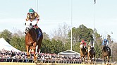 American Promise, a 3-year-old colt trained by D. Wayne Lukas and ridden by jockey Nik Juarez, captures the 2025 Virginia Derby at Colonial Downs with a record-setting time of 1:46.41 for the 1 1/8-mile race.