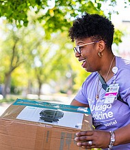 Shanice Williams is the OB Program Manager, Section Administrator OB/GYN at UChicago Medicine Ingalls Memorial Hospital, giving out free car seats during the hospital’s 2024 Drive-Thru Baby Shower. Photo provided by UChicago Medicine Ingalls Memorial Hospital.