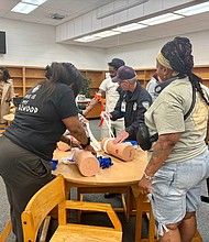 During the Chicago Department of Public Health Gun Safety Workshops people can receive training on Stop the Bleed and receive gun locks. Photo provided by CDPH.