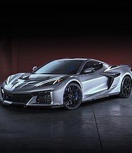 Front 3/4 view of 2026 Chevrolet Corvette ZR1X in Blade Silver Metallic. Preproduction model shown, actual production model may vary.
