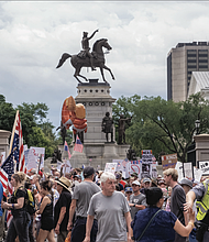 Thousands marched June 14 from Capitol Square to Kanawha Plaza to protest the Trump administration’s policies.