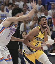 Indiana Pacers guard Tyrese Haliburton (0) drives past Oklahoma City Thunder forward Chet Holmgren (7) during the second half of Game 5 of the NBA Finals basketball series, Monday, June 16, 2025, in Oklahoma City.