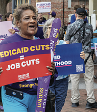 Tina Buskey, a public school worker joins demonstrators that protested Sears’ silence on proposed Medicaid cuts. Buskey, who has dealt with severe illnesses, said, “Without Medicaid, I would be dead.”