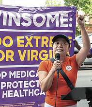 Tram Nguyen, co-executive director of New Virginia Majority, speaks during the protest.