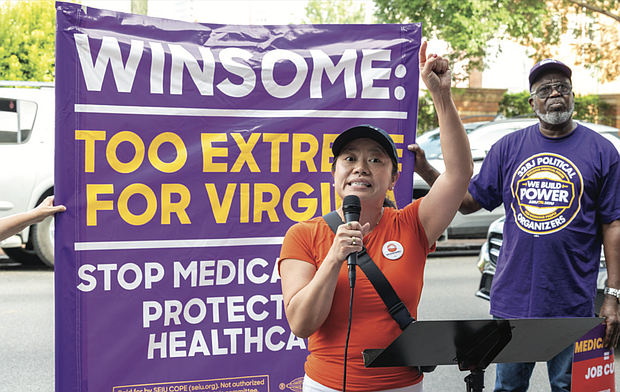 Tram Nguyen, co-executive director of New Virginia Majority, speaks during the protest.