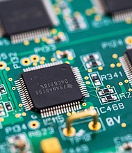 An integrated circuit microchip manufactured by Texas Instruments. The company pledged a major investment to expand US plants.
Mandatory Credit:	Chris Ratcliffe/Bloomberg/Getty Images via CNN Newsource