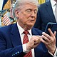 President Donald Trump silences his mobile phone.
Mandatory Credit:	Evan Vucci/AP/File via CNN Newsource