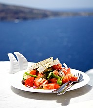 Greek salad is known as "village salad" in Greece. It includes tomatoes and a wedge of feta.
Mandatory Credit:	ingwervanille/Moment RF/Getty Images via CNN Newsource