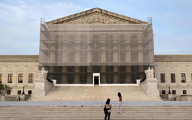 The Supreme Court on June 23 granted President Donald Trump’s emergency request to resume deporting migrants to countries other than their homeland. People take photos at the US Supreme Court at dusk on June 10 in Washington, DC.
Mandatory Credit:	Kevin Carter/Getty Images via CNN Newsource