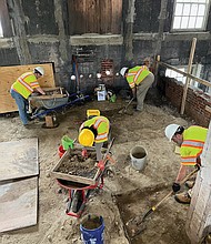 Archaeologists from the William & Mary Center for Archaeological Research work at the dig site beneath Gates Hall at Willam and Mary.