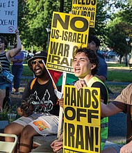 Demonstrators gathered at Monroe Park for a rally Wednesday, June 18, organized by the Party for Socialism and Liberation, Virginia, to oppose U.S. involvement in aggression against Iran and to protest ongoing violence in Palestine.