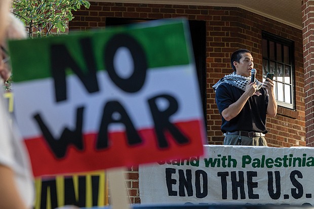 Noah Irikawa speaks during a rally Wednesday, June 18, in Monroe Park to oppose U.S. military involvement with Iran and to protest violence in Palestine.