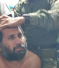 In this handout image provided by the armed forces of Ecuador, Jose Adolfo Macias is captured in Manta, Ecuador, on June 25.
Mandatory Credit:	Handout/Getty Images via CNN Newsource