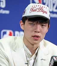Yang Hansen speaks to the media after being drafted 16th oveall by the Memphis Grizzlies then traded to the Portland Trail Blazers during the 2025 NBA Draft.
Mandatory Credit:	Mike Lawrie/Getty Images via CNN Newsource