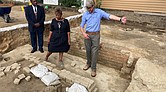 From left, Reginald F. Davis, pastor of First Baptist Church, Connie Matthews Harshaw, a member of First Baptist and Jack Gary, Colonial Williamsburg’s director of archaeology, stand at the foundation of one the oldest Black churches in the U.S. in 2021, in Williamsburg.