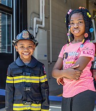 Nehemiah Bacot, 6, and his sister Zariyah Bacot, 10, attend the Richmond Fire Department’s grand opening of the newly constructed Fire Station 12 on Wednesday, June 25, at 2223 West Cary St. The new facility replaces the city’s oldest operating station.