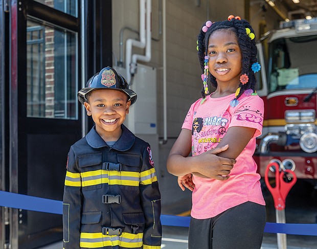 Nehemiah Bacot, 6, and his sister Zariyah Bacot, 10, attend the Richmond Fire Department’s grand opening of the newly constructed Fire Station 12 on Wednesday, June 25, at 2223 West Cary St. The new facility replaces the city’s oldest operating station.
