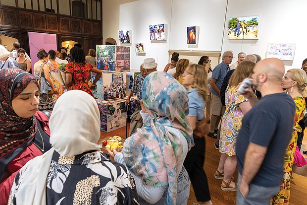 Guests mingle at the Juneteenth opening of “(re)Framing Protest (NOW): Design + Hope” and “Echoes of Us” at the Branch Museum of Architecture and Design. The exhibitions feature work by more than 15 Black artists from Virginia and explore national conversations on race, protest and cultural memory through art and design.