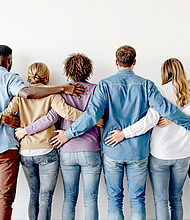 A diverse group of individuals standing together, showing unity and support, on a plain background. Ai generative