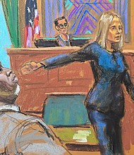 Prosecutor Emily Johnson points to Sean "Diddy" Combs in front of US District Judge Arun Subramanian at Combs' trial in New York City in this courtroom sketch.
Mandatory Credit:	Jane Rosenberg/Reuters via CNN Newsource