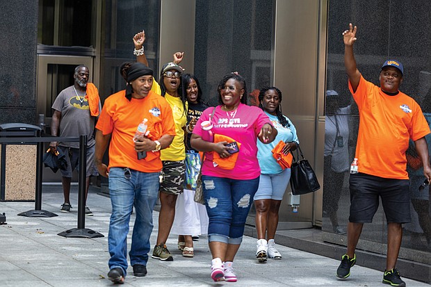 The “RPS Five” — bus drivers fired April 25 following coordinated absences — leave City Hall to cheers after a press conference announcing their reinstatement under a new three-year collective bargaining agreement between Richmond Public Schools and LIUNA Local 804. The
drivers return with six-hour shifts at full pay.