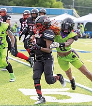 Shawnisa Estep (5) of Richmond’s Black Widows breaks through defenders during a playoff matchup against the Upstate New York Lady Predators on Saturday, June 28. The Black Widows dominated in a 27-0 shutout to clinch a spot in the conference championship as they continue their run toward a national title. The team will host the SemiFinals on July 12.