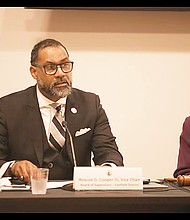 Henrico County Board Vice Chair Roscoe D. Cooper III speaks as he and Richmond City Council President Cynthia Newbille, right, co-chair a meeting Monday on the region’s drinking water system.