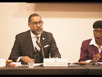 Henrico County Board Vice Chair Roscoe D. Cooper III speaks as he and Richmond City Council President Cynthia Newbille, right, co-chair a meeting Monday on the region’s drinking water system.