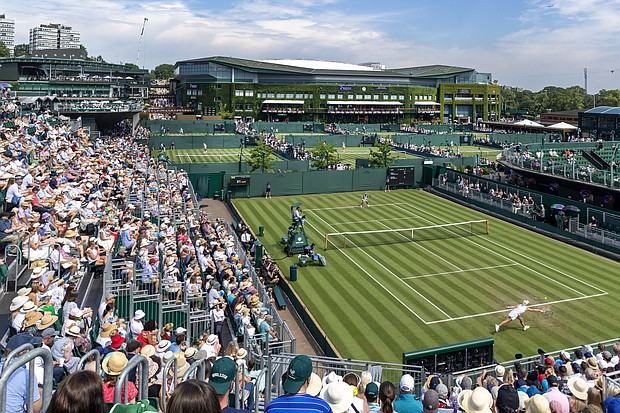 Spectators pack out the stands at Wimbledon, where for the first time there are no line judges.
Mandatory Credit:	Tim Clayton/Corbis Sport/Getty Images via CNN Newsource