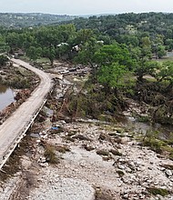 A drone view shows the Guadalupe River and damage from flooding near Camp Mystic in Hunt, Texas, on July 5.
Mandatory Credit:	Evan Garcia/Reuters via CNN Newsource