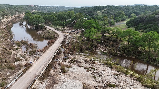 A drone view shows the Guadalupe River and damage from flooding near Camp Mystic in Hunt, Texas, on July 5.
Mandatory Credit:	Evan Garcia/Reuters via CNN Newsource