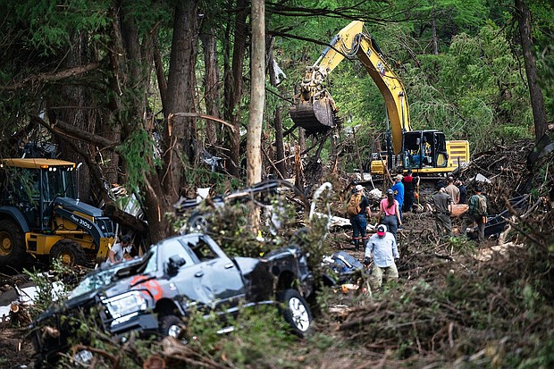 Caption:	First responders carry out search and rescue operations near the Guadalupe River after a flash flood swept through the area.
Mandatory Credit:	Eli Hartman/AP via CNN Newsource