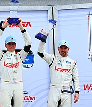 No. 99 Hyundai Elantra N TCR drivers Tyler Gonzalez and Eric Powell are photographed on the podium after the LP Building Solutions 120 in Watkins Glen, NY, June 21, 2025. (Photo/Bryan Herta Autosport/Richard Prince Photography)