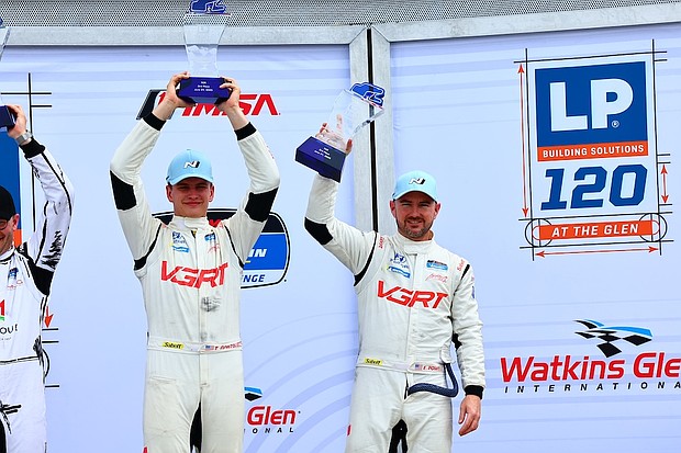 No. 99 Hyundai Elantra N TCR drivers Tyler Gonzalez and Eric Powell are photographed on the podium after the LP Building Solutions 120 in Watkins Glen, NY, June 21, 2025. (Photo/Bryan Herta Autosport/Richard Prince Photography)