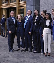 Defense attorneys for Sean “Diddy” Combs, including from left, Brian Steel, Alexandra Shapiro, Marc Agnifilo and Teny Garagos, Anna Estevao, Nicole Westmoreland, Jason Driscoll and Xavier Donaldson, far right, line up for a group photo outside Manhattan federal court after Sean “Diddy” Combs was denied bail after being convicted of prostitution-related offenses but acquitted of sex trafficking and racketeering charges, Wednesday, July 2 in New York.