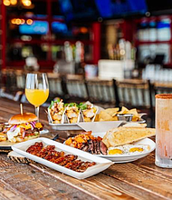 Avalanche Food Group Founders Ricky Rosa, Joe Rosa (left) and John Rosa (center) treated teachers and their families to meals at Twin Peaks and Bread Zeppelin before the 2024 grant check presentations.

Photo: Avalanche Food Group