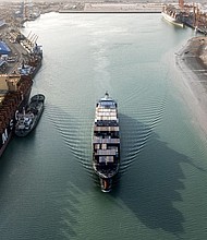 This aerial view shows a container ship cruising at the port of Umm Qasr in Iraq's southern city of Basra. Iraq was among the latest countries to receive a letter from President Donald Trump informing the nation of the rate its goods will be tariffed as of August 1, absent a trade deal.
Mandatory Credit:	Hussein Faleh/AFP/Getty Images via CNN Newsource