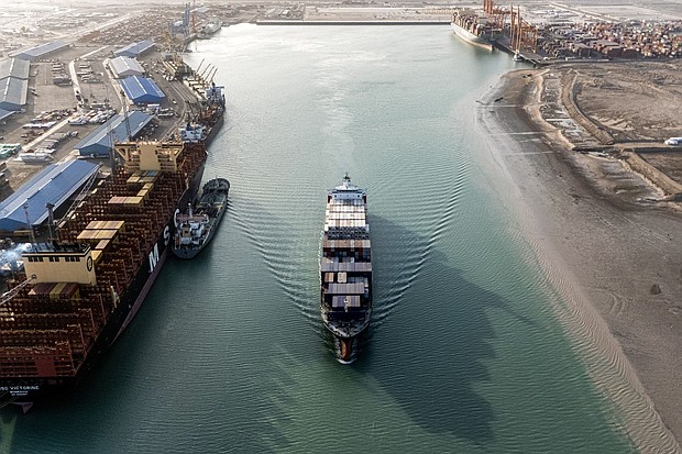 This aerial view shows a container ship cruising at the port of Umm Qasr in Iraq's southern city of Basra. Iraq was among the latest countries to receive a letter from President Donald Trump informing the nation of the rate its goods will be tariffed as of August 1, absent a trade deal.
Mandatory Credit:	Hussein Faleh/AFP/Getty Images via CNN Newsource