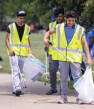 Danish Hussain, 16; Taha Aman, 17; and Talha Amanm, 17, joined the group in picking up trash along Wharf Street near the river.