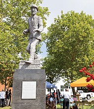 The Astoria Beneficial Club Inc. honored the legacy of Bill “Bojangles” Robinson on Saturday, June 28, with its 52nd anniversary commemorative service at the park on Adams and Leigh streets. The bronze statue of Robinson, unveiled in 1973, stands at an intersection where he funded the installation of a traffic light to protect children crossing the street.