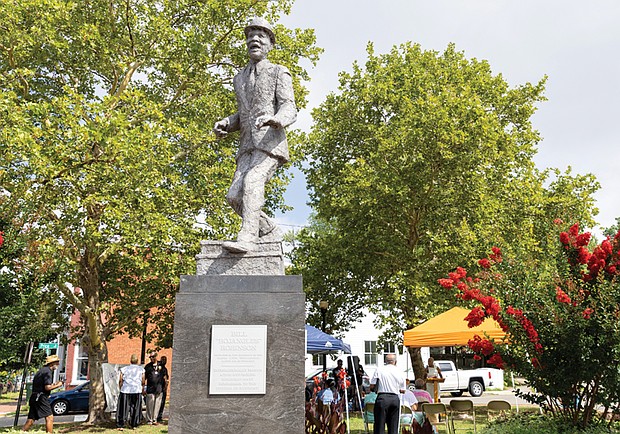 The Astoria Beneficial Club Inc. honored the legacy of Bill “Bojangles” Robinson on Saturday, June 28, with its 52nd anniversary commemorative service at the park on Adams and Leigh streets. The bronze statue of Robinson, unveiled in 1973, stands at an intersection where he funded the installation of a traffic light to protect children crossing the street.
